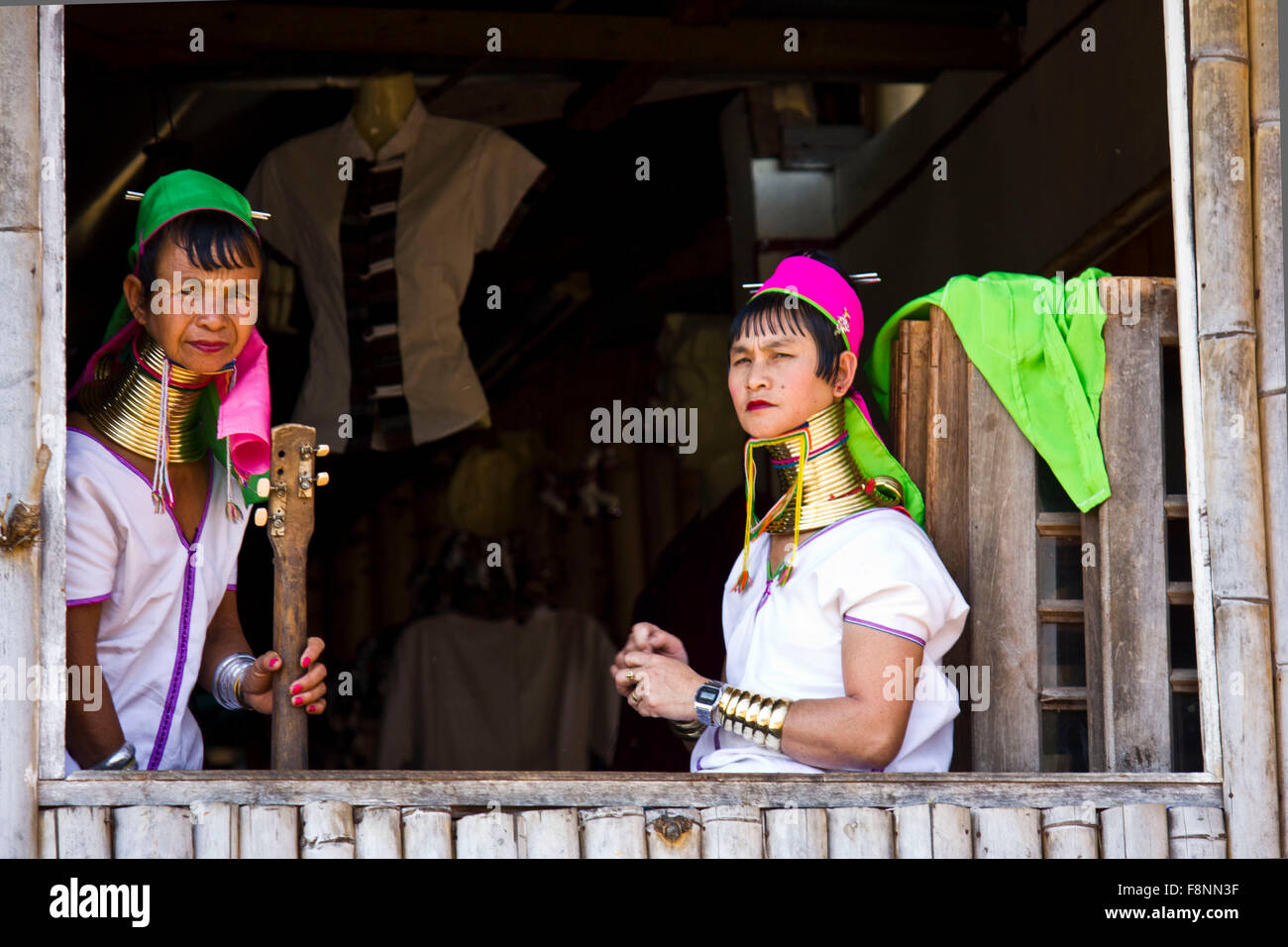 The Kayan women wear brass coils around their necks to give the