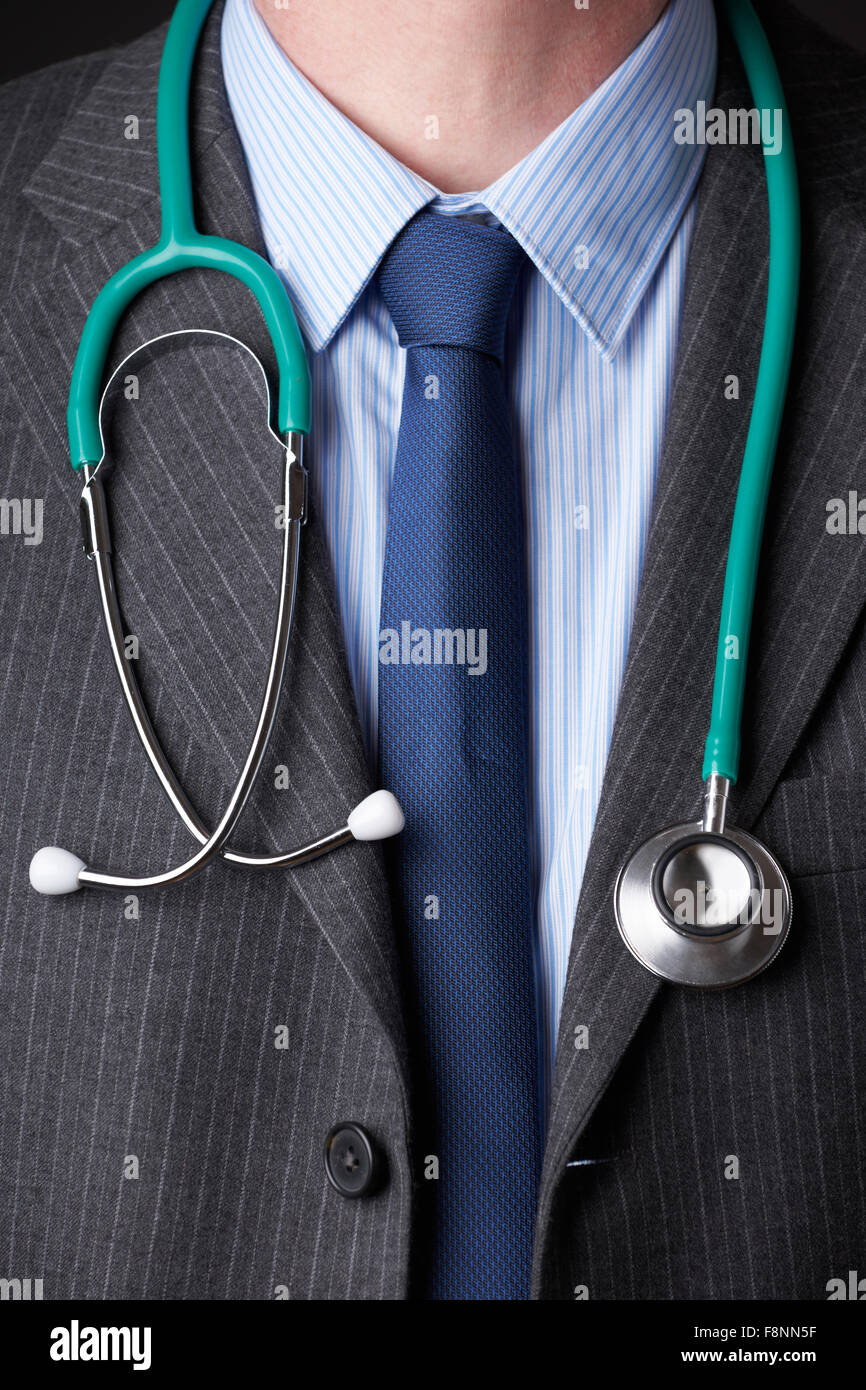 Detail Of Doctor Wearing Suit With Stethoscope Around Neck Stock Photo
