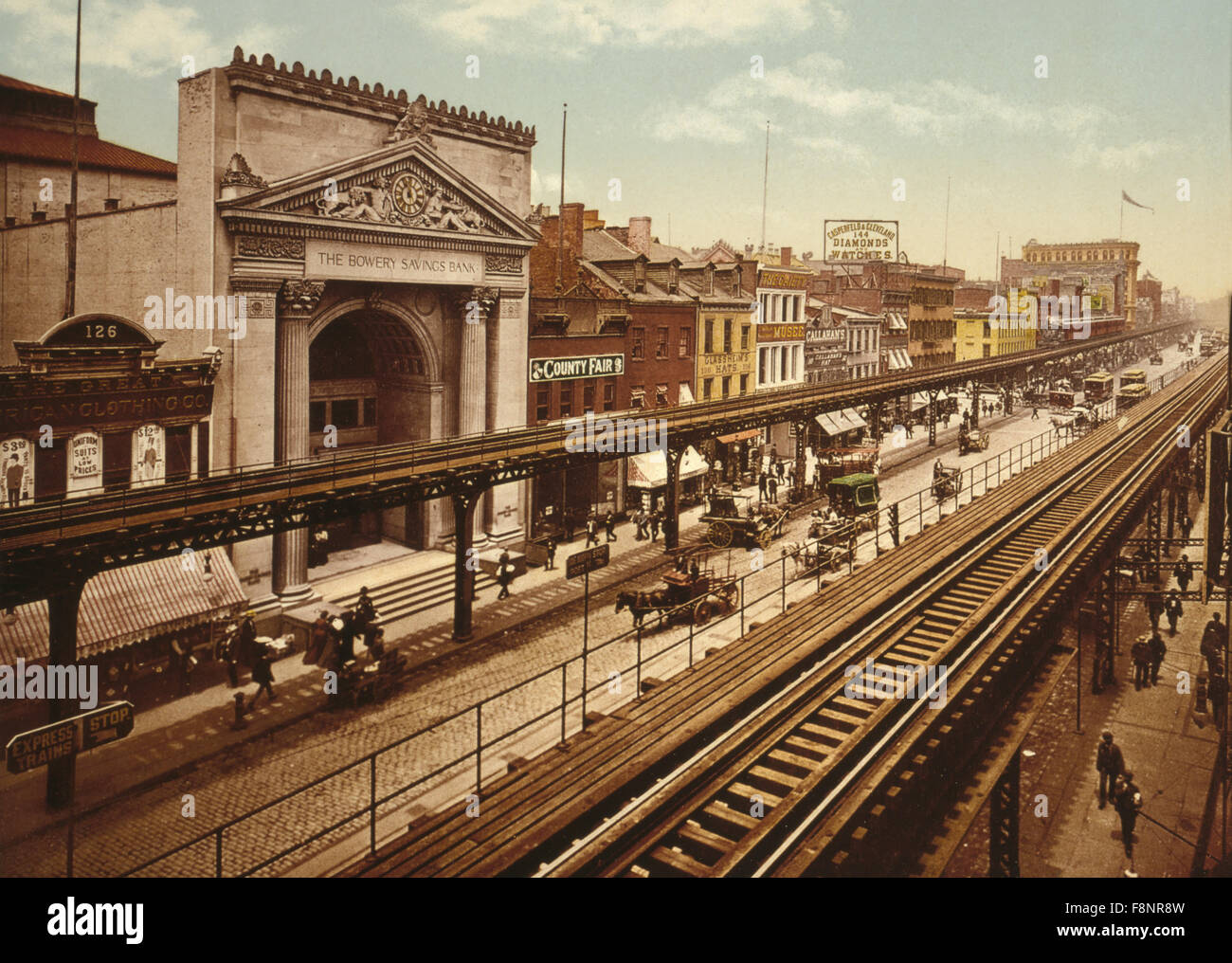 Buildings and Elevated Train Tracks Along the Bowery, New York City, USA, circa 1900 Stock Photo