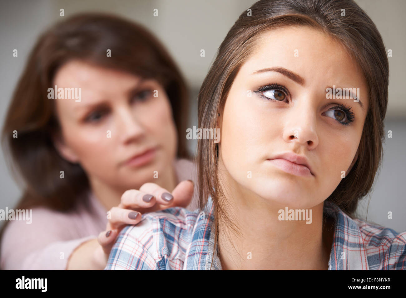 Mother Worried About Unhappy Teenage Daughter Stock Photo