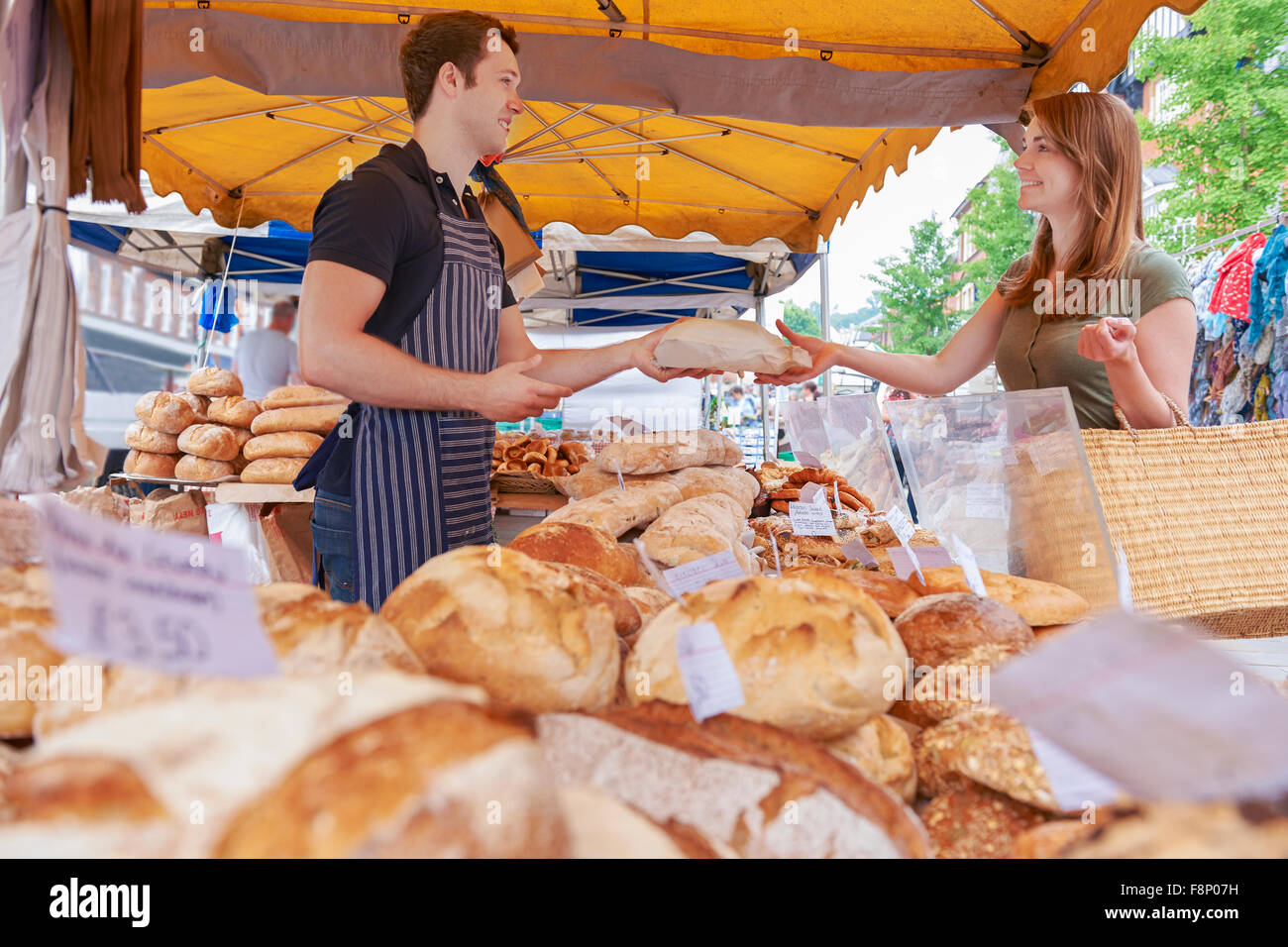 Customer Buying Loaf From Market Bread Stall Stock Photo