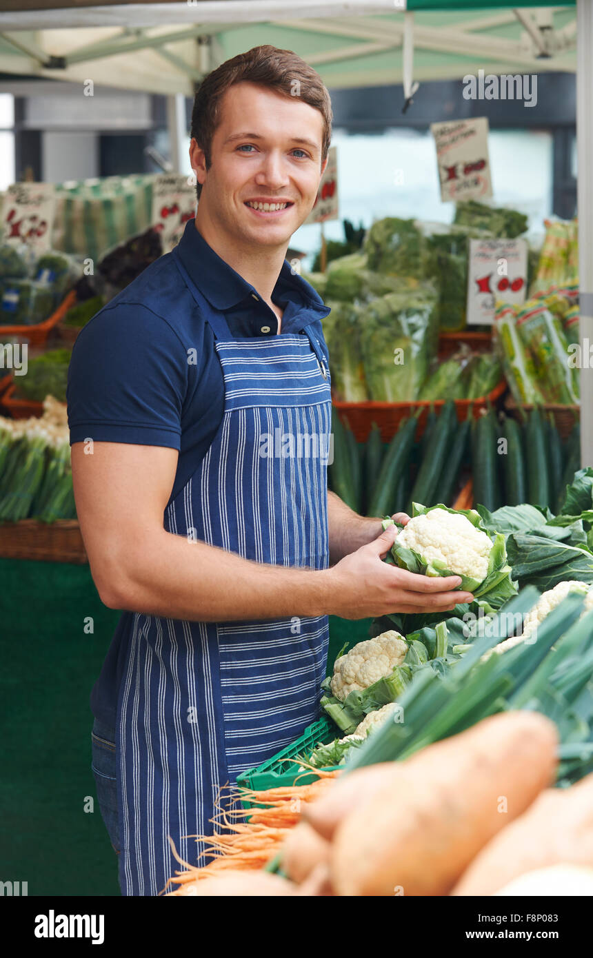 Stall Holder Arranging Display At Vegetable Market Stock Photo Alamy