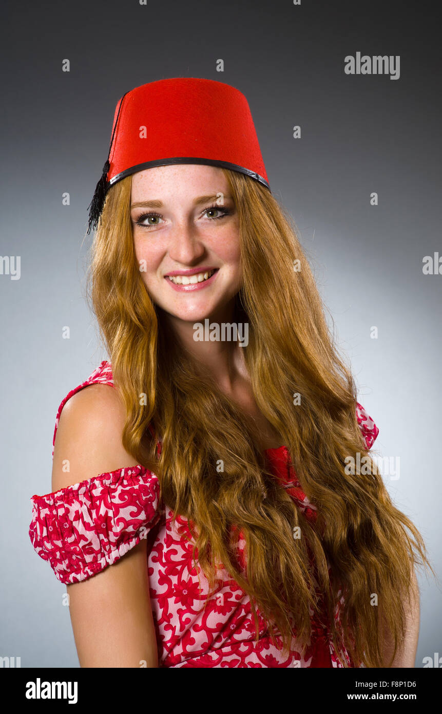 Woman wearing red fez hat Stock Photo - Alamy