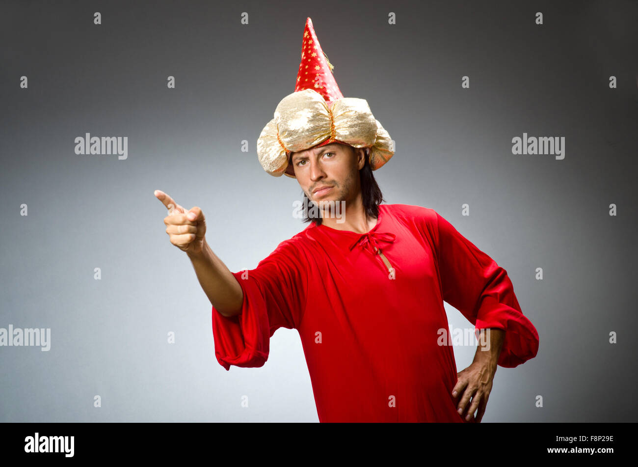 Funny wizard wearing red dress Stock Photo - Alamy