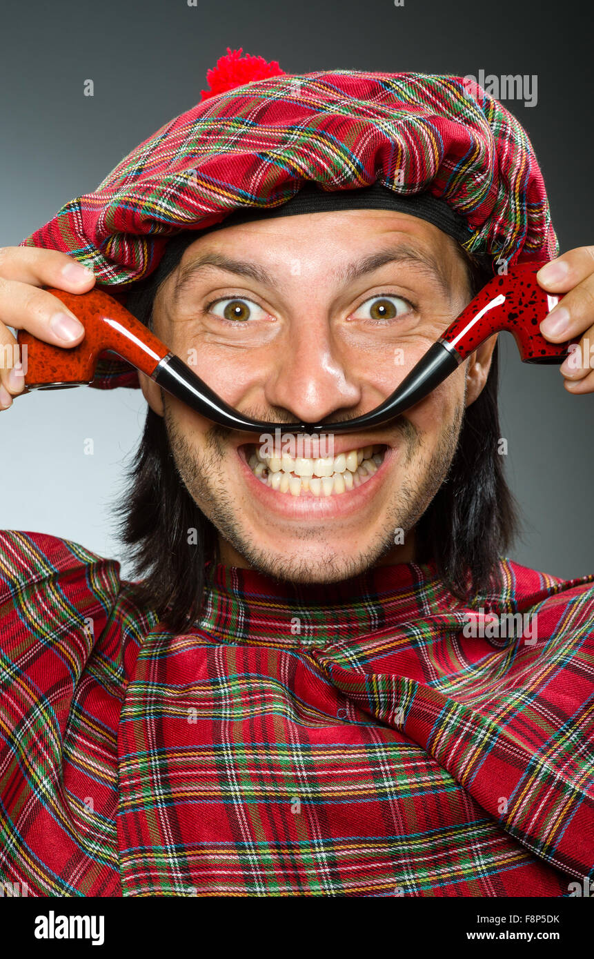 Funny scotsman with smoking pipe Stock Photo Alamy
