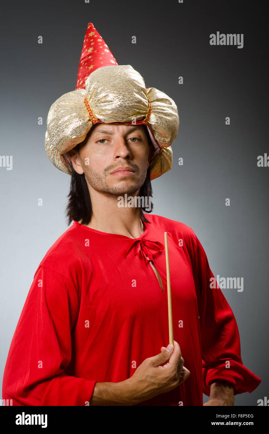 Funny wizard wearing red dress Stock Photo - Alamy