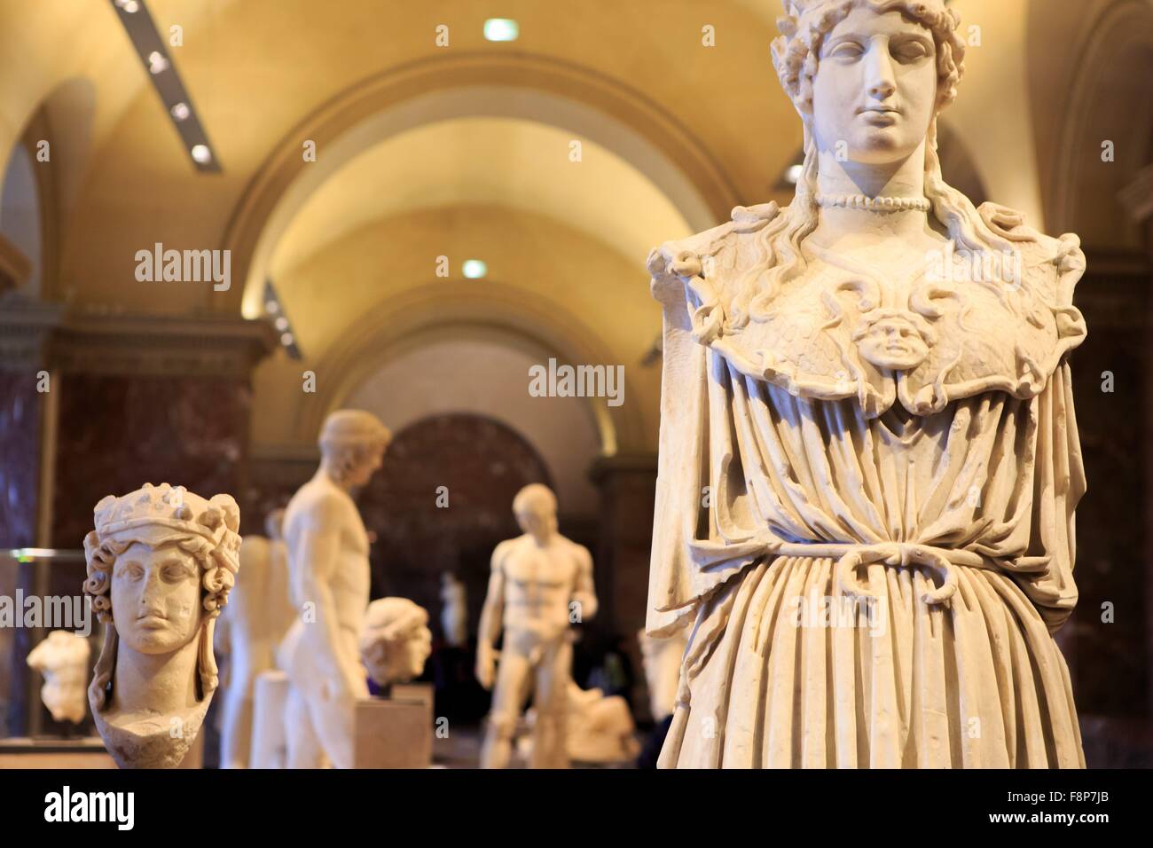 Ancient Greek statues on display at The Louvre Museum in Paris, France