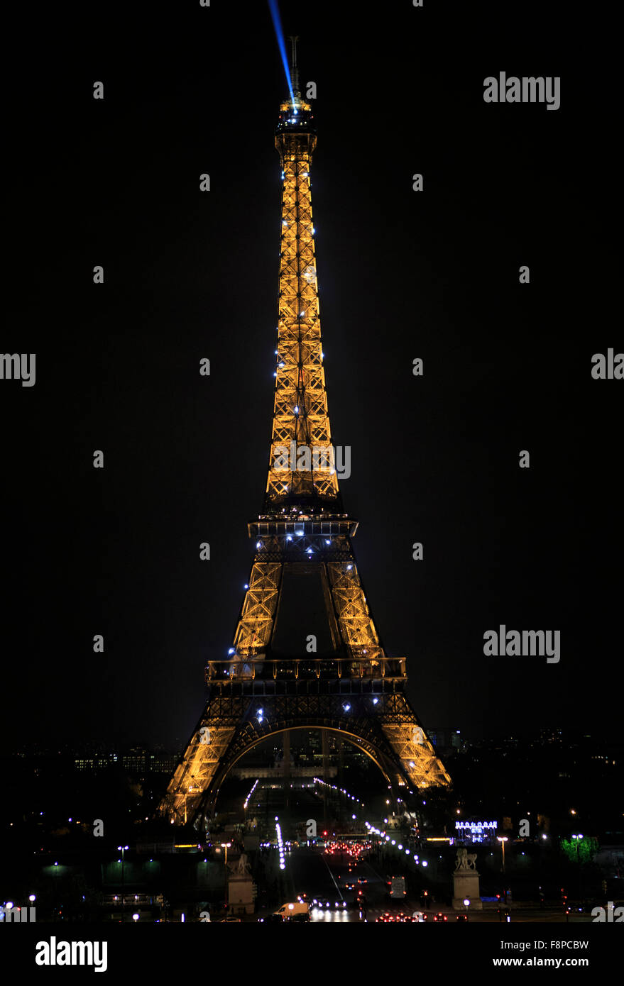 The Eiffel Tower lights up the night sky in Paris, France Stock Photo