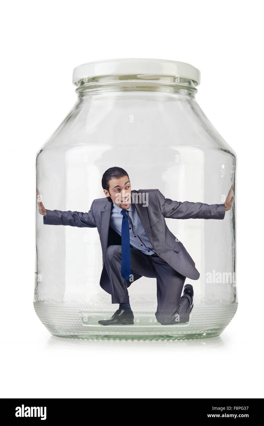 Young businessman in glass jar Stock Photo