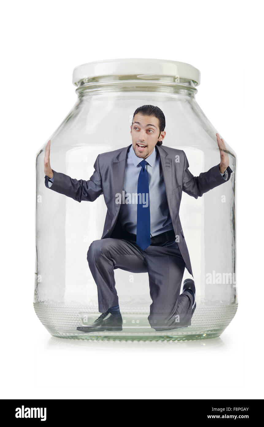 Young businessman in glass jar Stock Photo