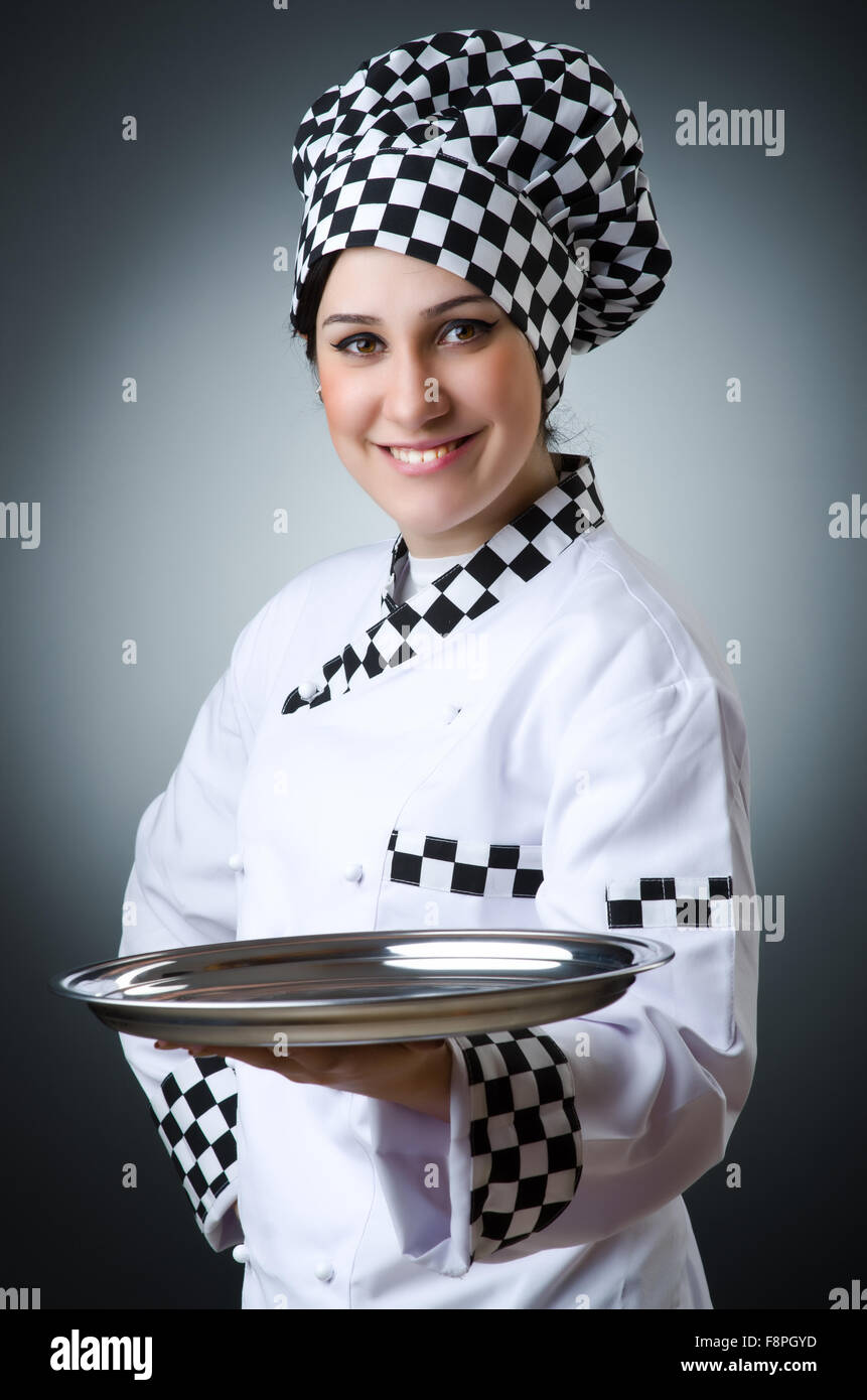 Pretty cook with kitchen utensils Stock Photo - Alamy