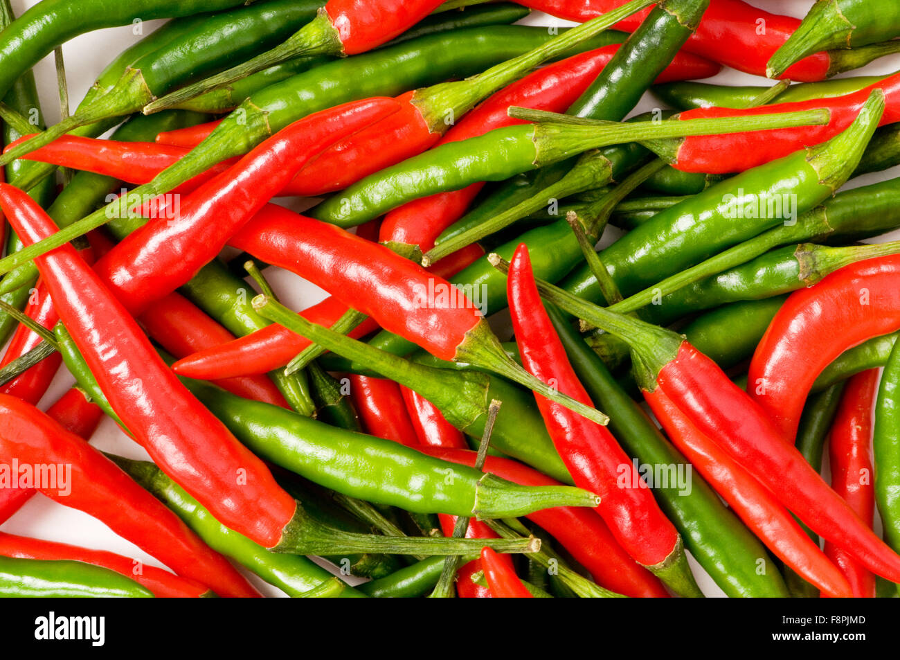 Red and green chili peppers at the background Stock Photo - Alamy