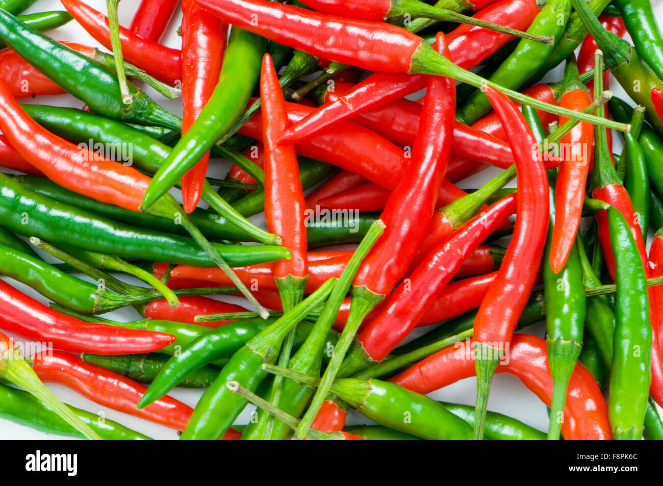 Red and green chili peppers at the background Stock Photo - Alamy