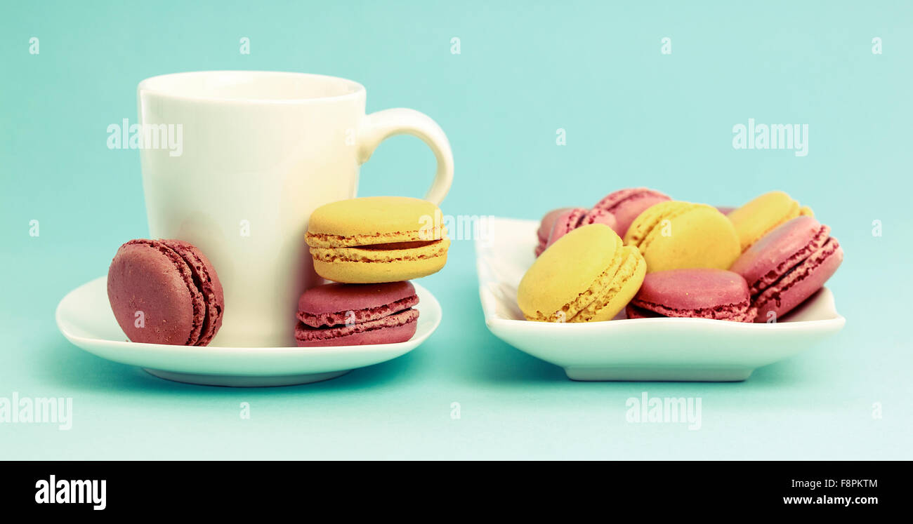 Plate of French Macaroons on retro-vintage background Stock Photo