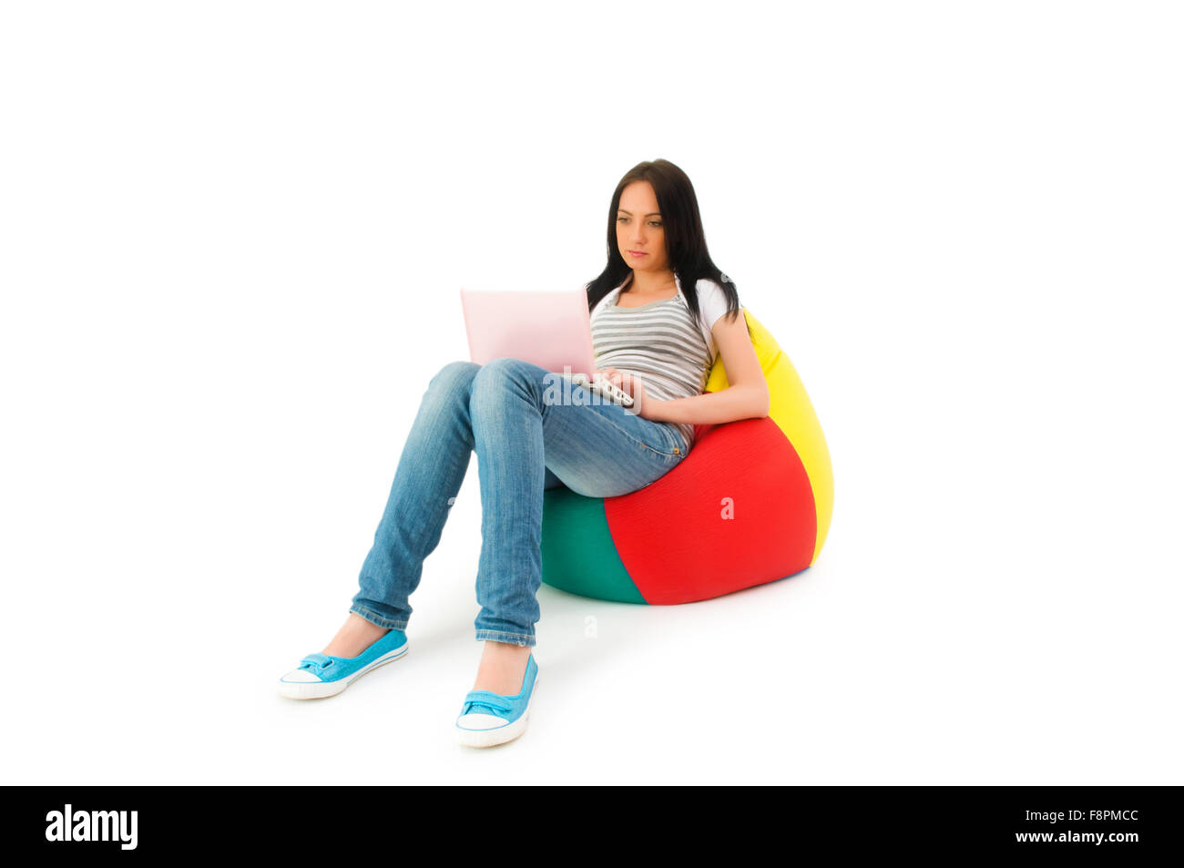 Girl working on laptop isolated on white Stock Photo - Alamy