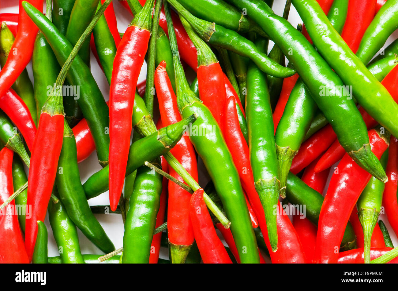 Red and green chili peppers Stock Photo - Alamy