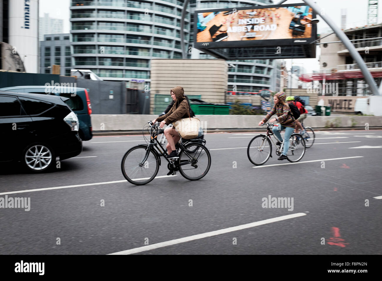 Cyclists speeding on busy London Road,Old Street,Roundabout,London,England Stock Photo