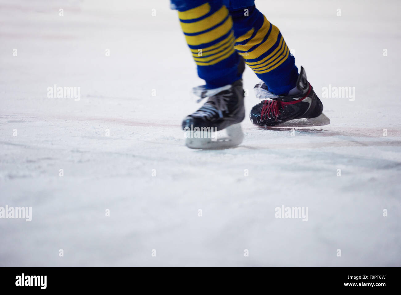 ice hockey player in action kicking with stick Stock Photo Alamy