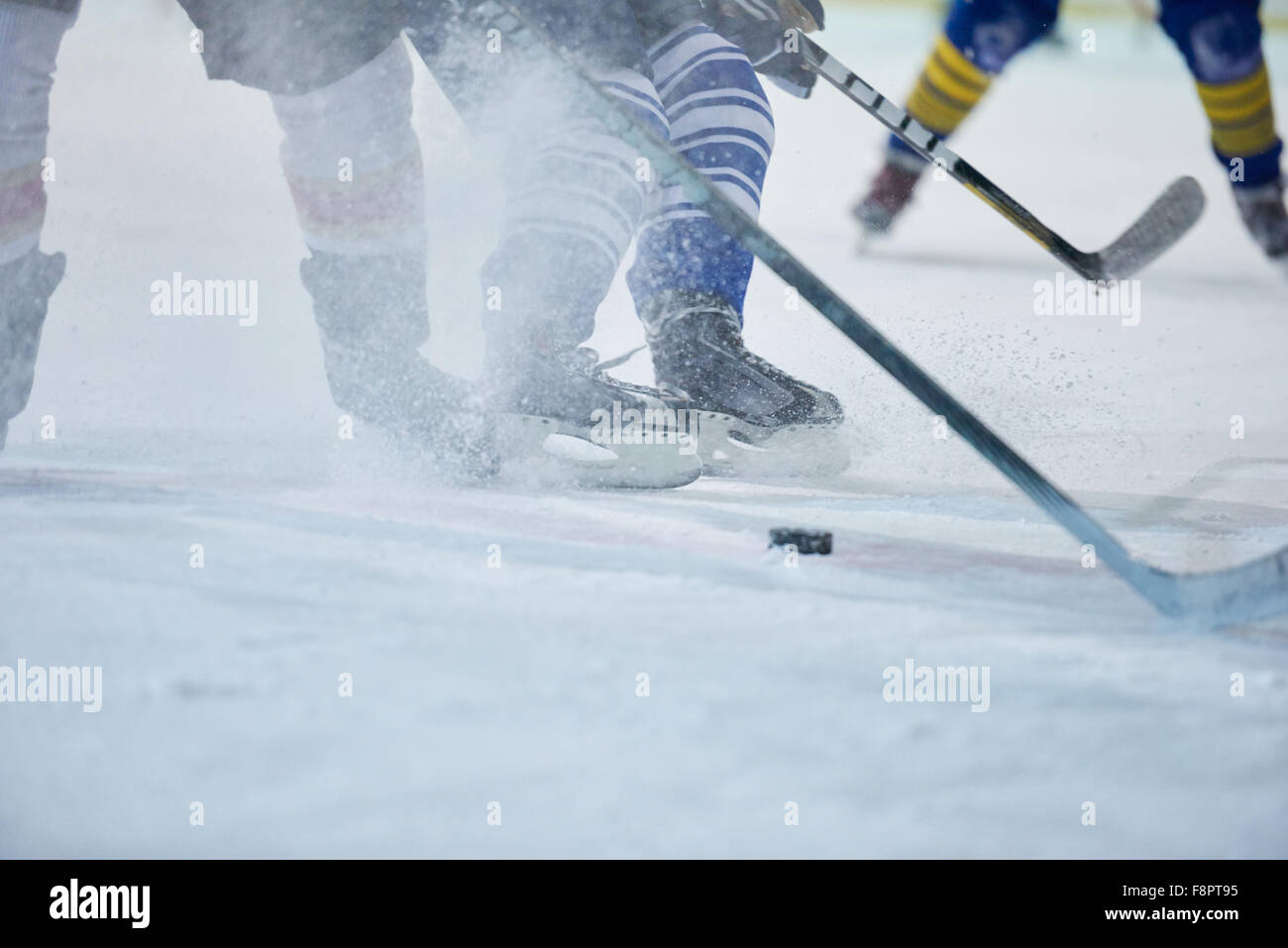ice hockey player in action kicking with stick Stock Photo Alamy