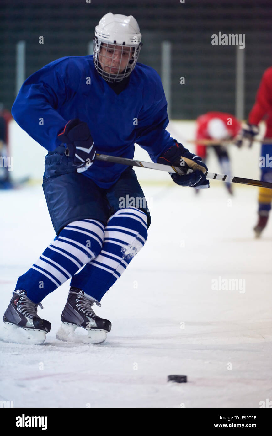 ice hockey player in action kicking with stick Stock Photo Alamy