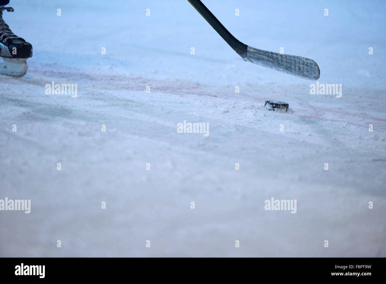 ice hockey player in action kicking with stick Stock Photo Alamy