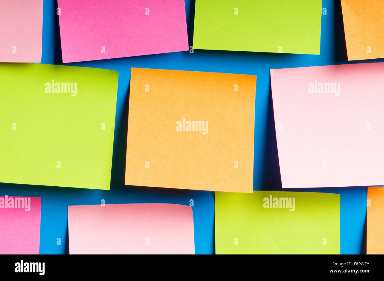 Reminder notes on the bright colorful paper Stock Photo - Alamy