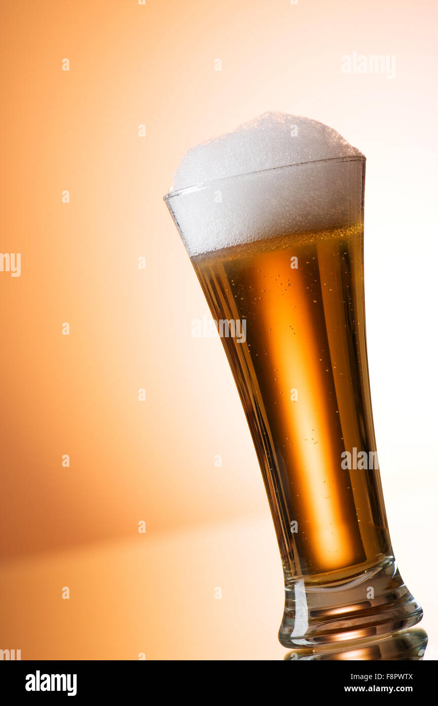 Beer glasses against the colorful gradient background Stock Photo