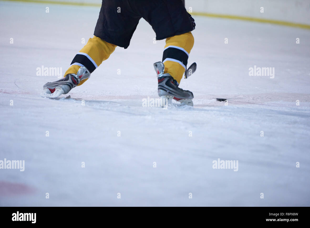 ice hockey player in action kicking with stick Stock Photo Alamy
