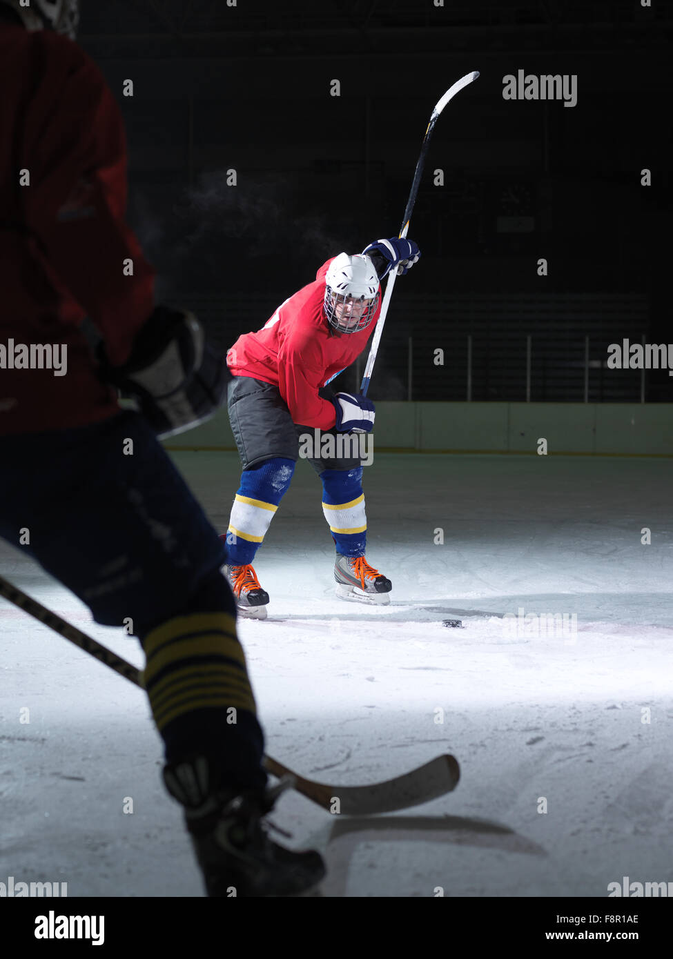 ice hockey player in action kicking with stick Stock Photo Alamy