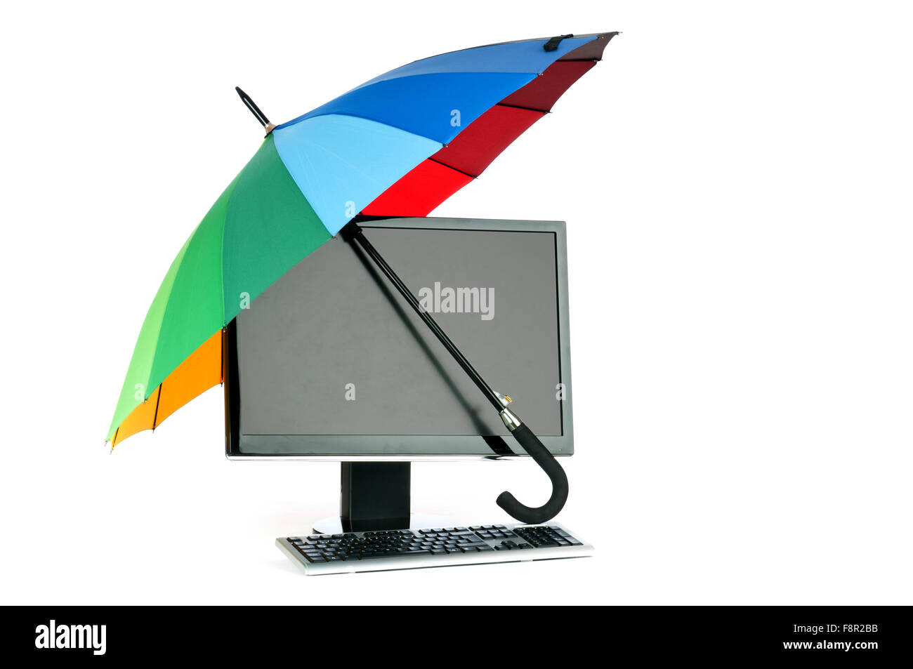 Computer under protection of umbrella Stock Photo Alamy