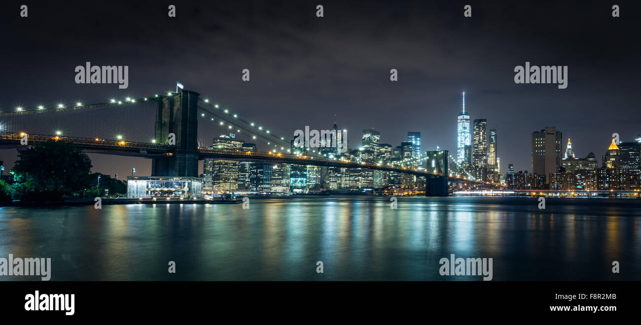 New York City - September 29 Brooklyn Bridge night view with lights reflection in Hudson River on September 29, 2015.Brooklyn B Stock Photo