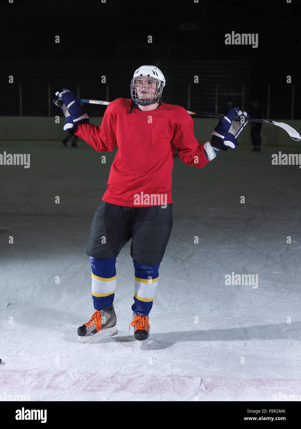 young ice hockey player portrait on training in black background Stock