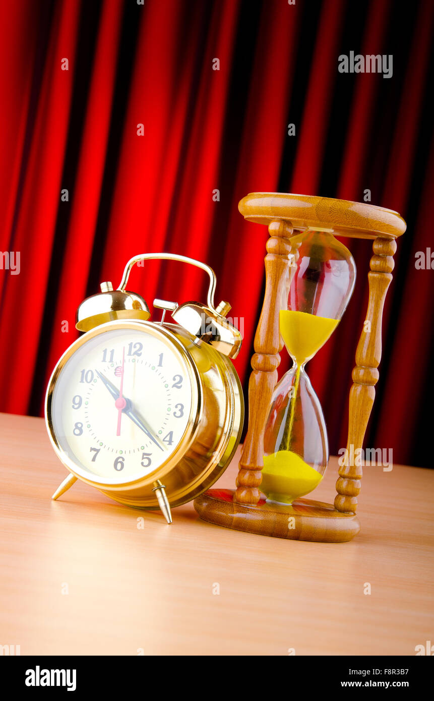 Hour Less Clock Time concept with clock and hour glass Stock Photo - Alamy