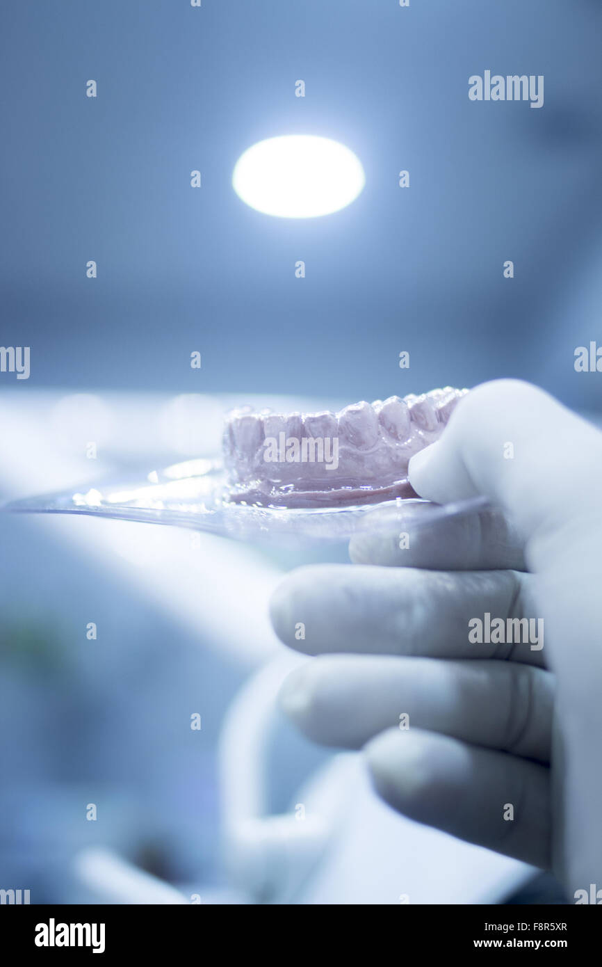 Dental mold dentist clay teeth plate ceramic colored cast model in steril plastic vacuum wrap