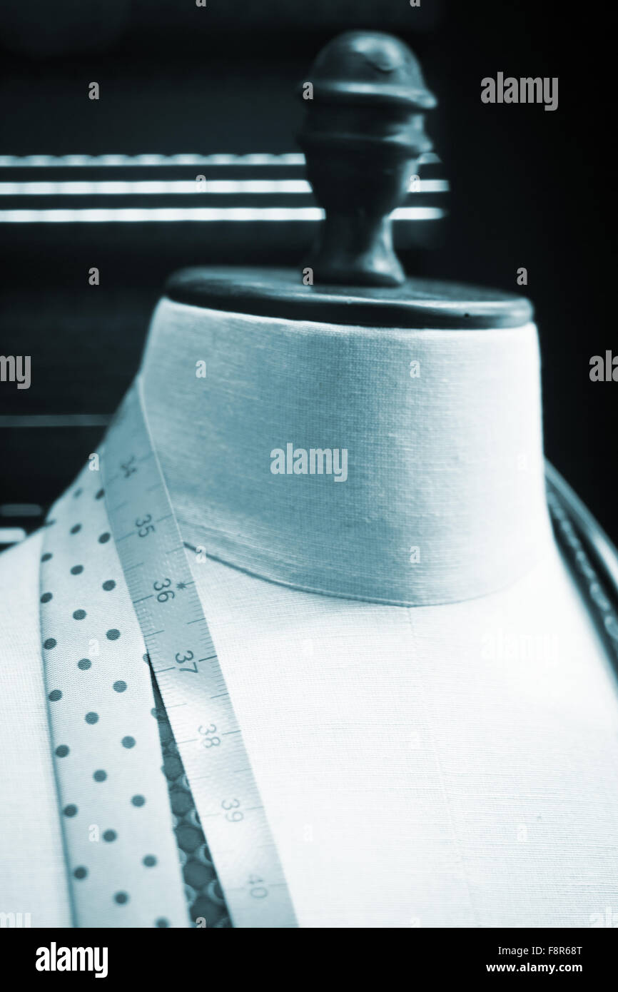 Shop dummy fashion mannequin in department store boutique window tape