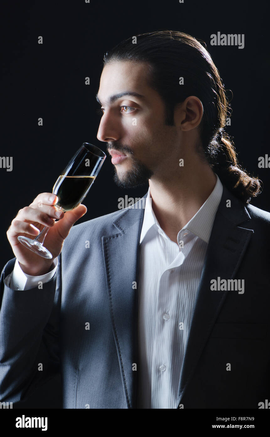 Man tasting wine in glass Stock Photo - Alamy