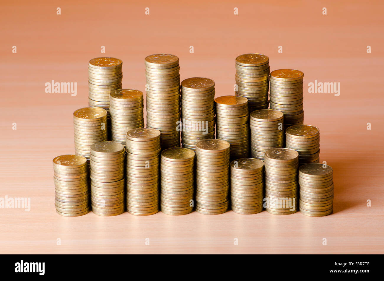 Golden coins in high stacks Stock Photo Alamy