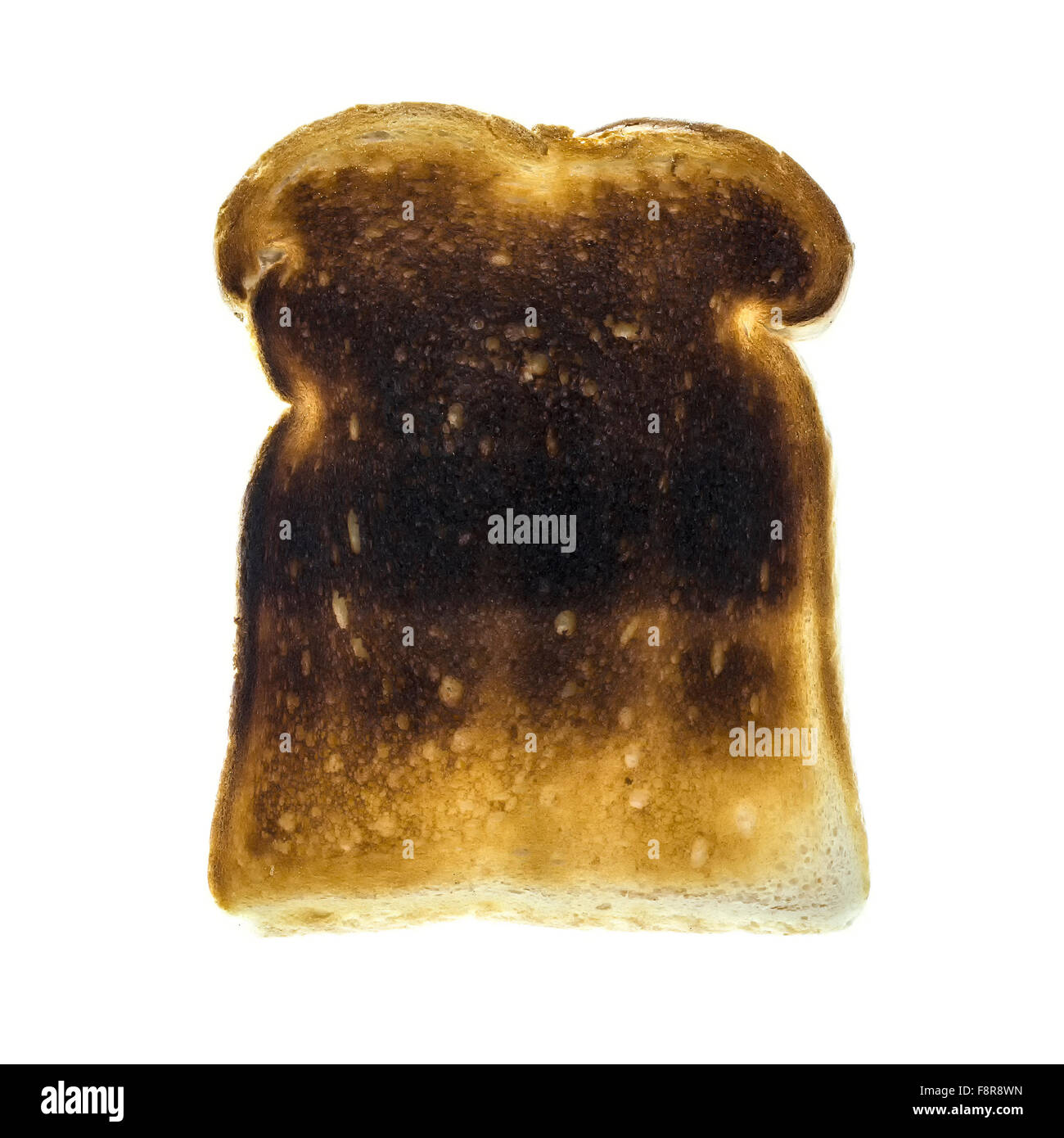 Burnt toast slice isolated on white background Stock Photo