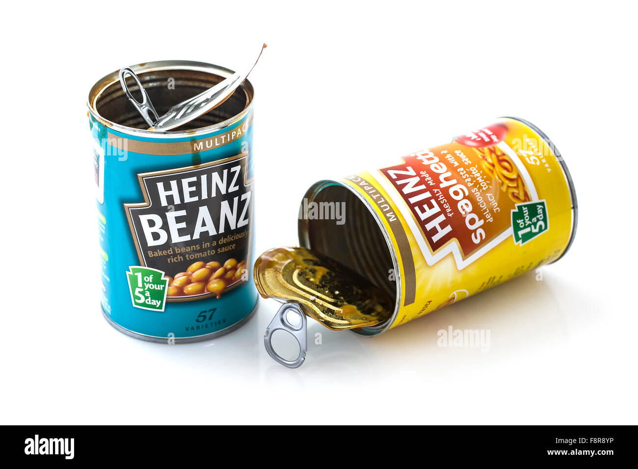 Cans of Heinz Beanz and Spaghetti isolated on white background. Stock Photo