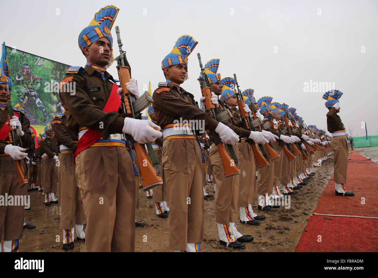 Srinagar, Kashmir. 11th Dec, 2015. Recruits of India's Central Reserve Police Force (CRPF) take part in a parade at a training center in Humhama on the outskirts of Srinagar, Indian-controlled Kashmir, Dec. 11, 2015. A total of 648 recruits were formally inducted into the India's CRPF after completing nine months of training in physical fitness, weapon handling, commando operations and counter insurgency, a CRPF spokesman said. Credit:  Xinhua/Alamy Live News Stock Photo
