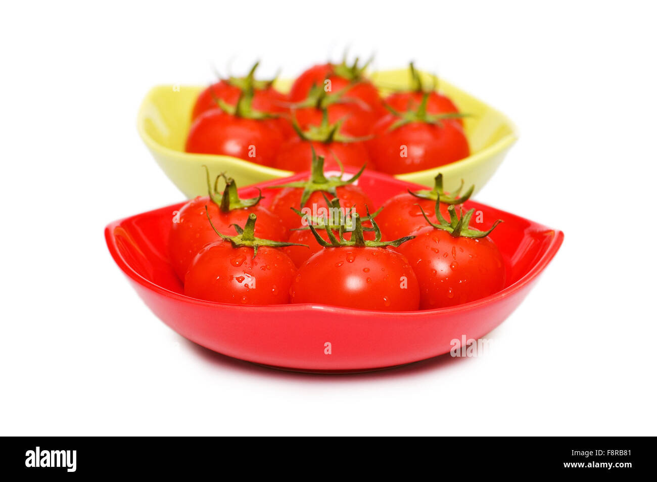 Wet whole tomatos isolated on white background Stock Photo - Alamy