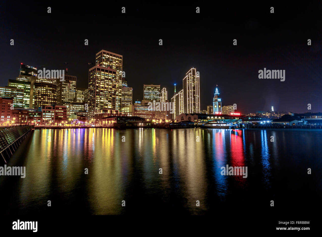 Ferry Building and Embarcadero Center illuminated at night in San Francisco, California, USA Stock Photo