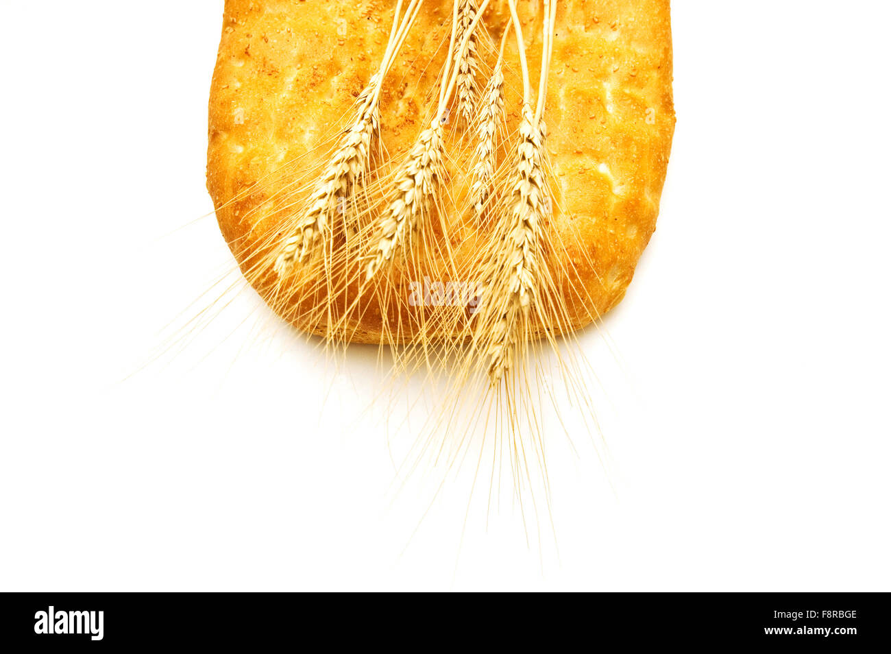 Bread and wheat ears isolated on white Stock Photo - Alamy