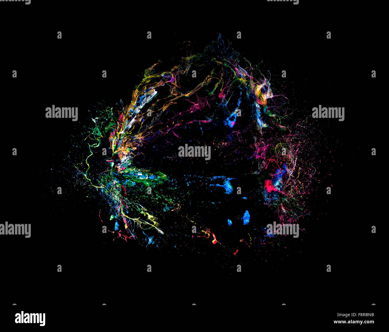 explosion of colorful paint on black background Stock Photo