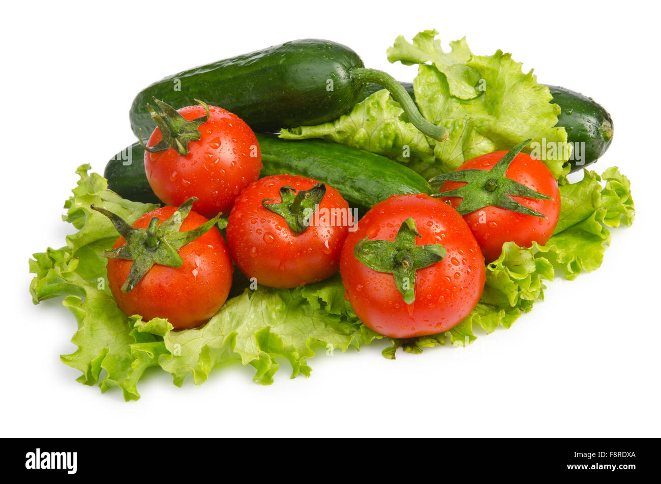 Cucumbers and tomatoes ready for salad Stock Photo - Alamy
