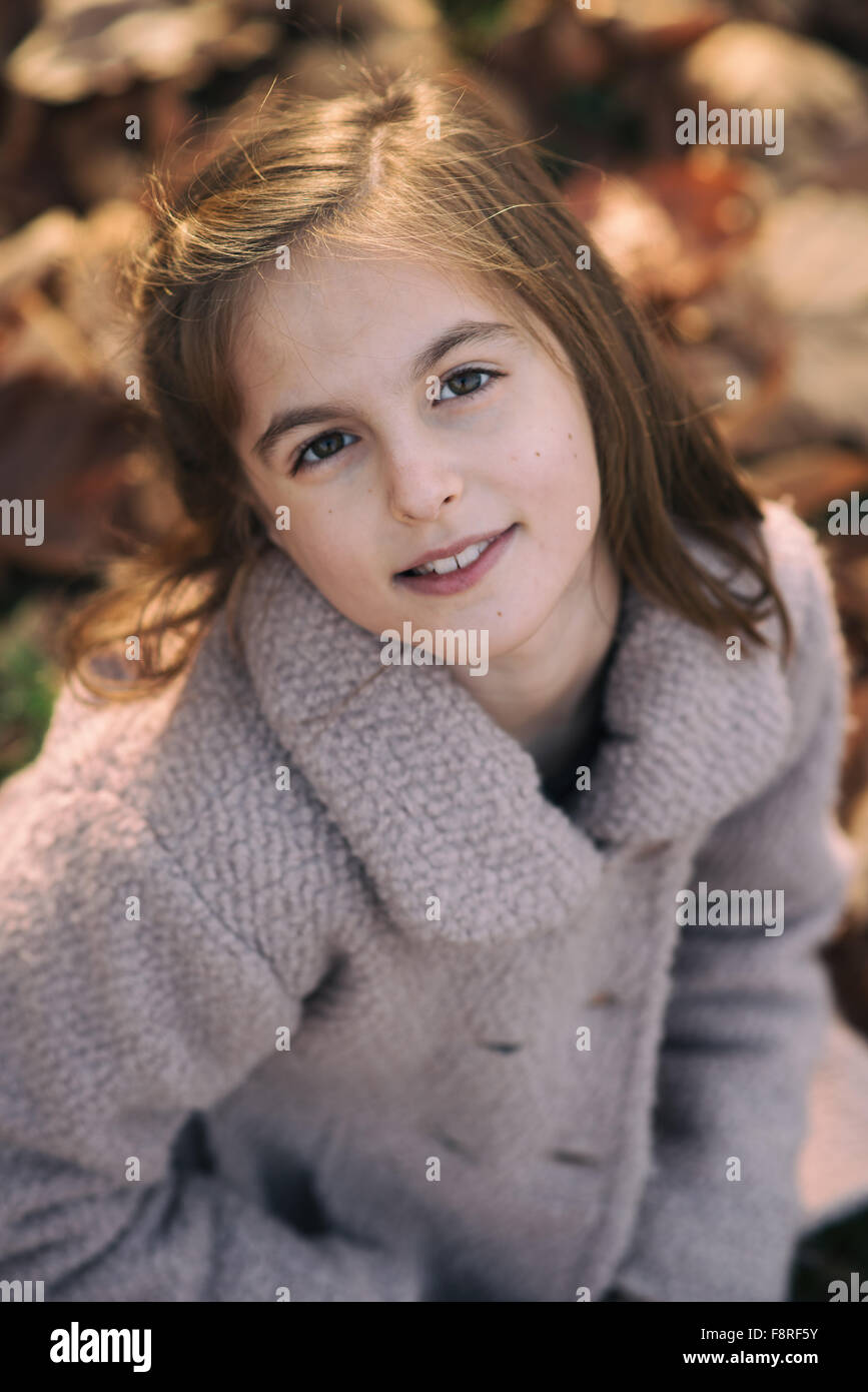 Portrait of a smiling girl looking up Stock Photo