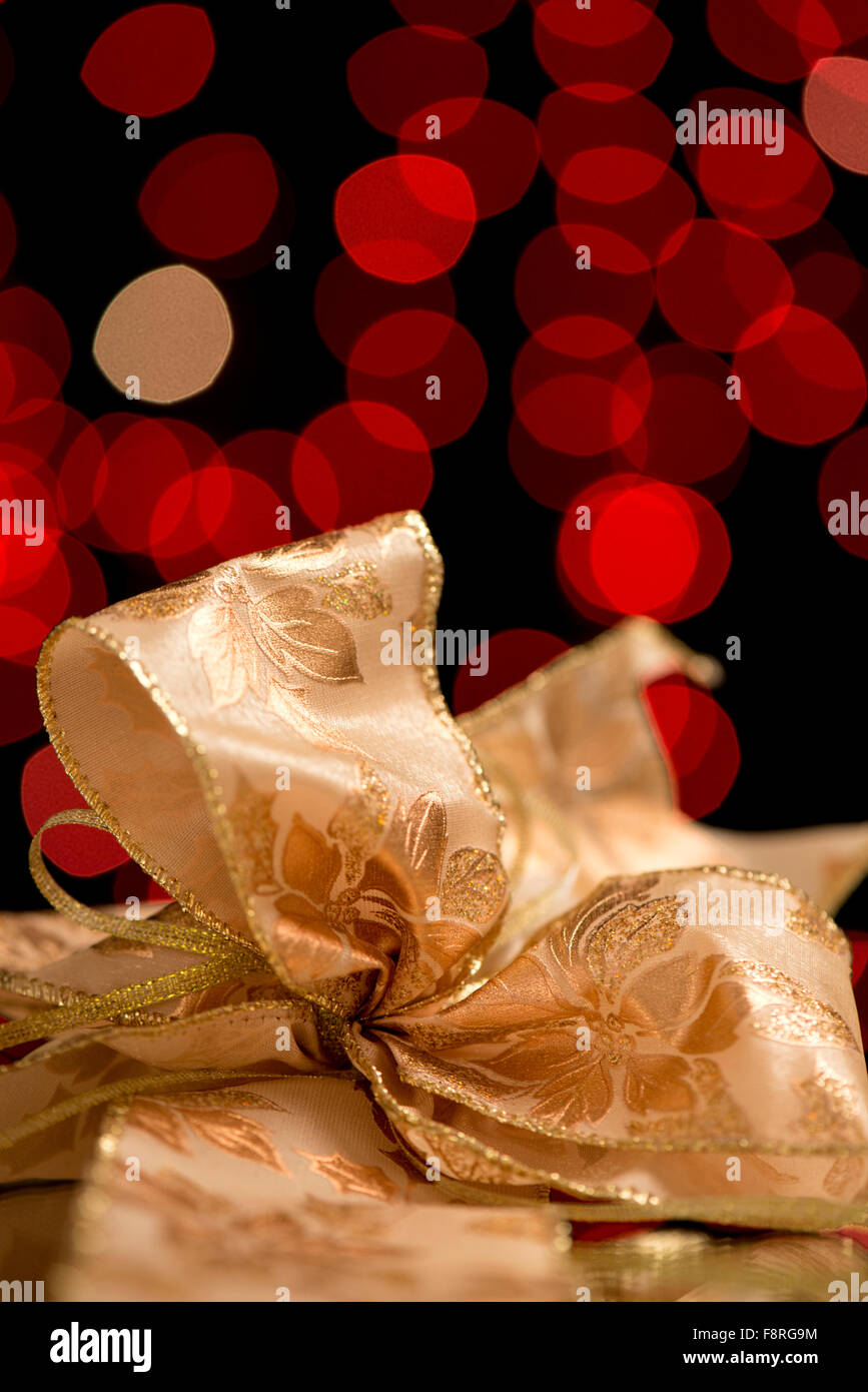 red lights with light, gold ribbons gifts as New Year and Christmas decoration Stock Photo