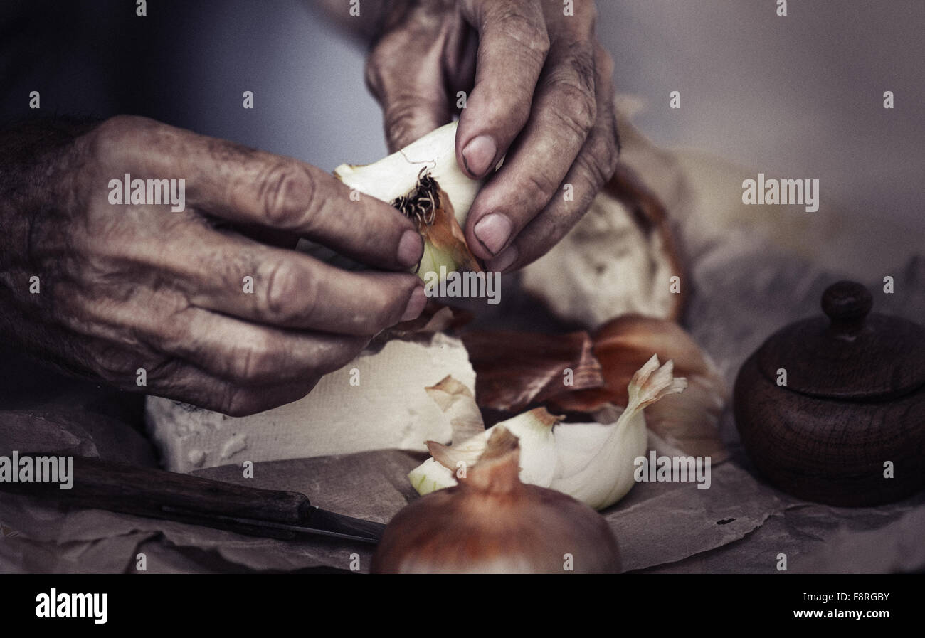 Senior man peeling onions hi-res stock photography and images - Alamy
