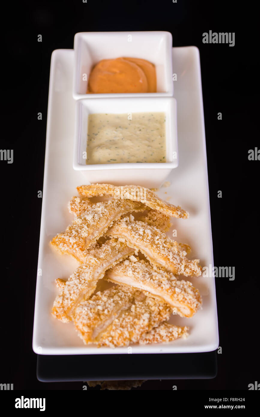 Fish fillets with sauces Stock Photo Alamy