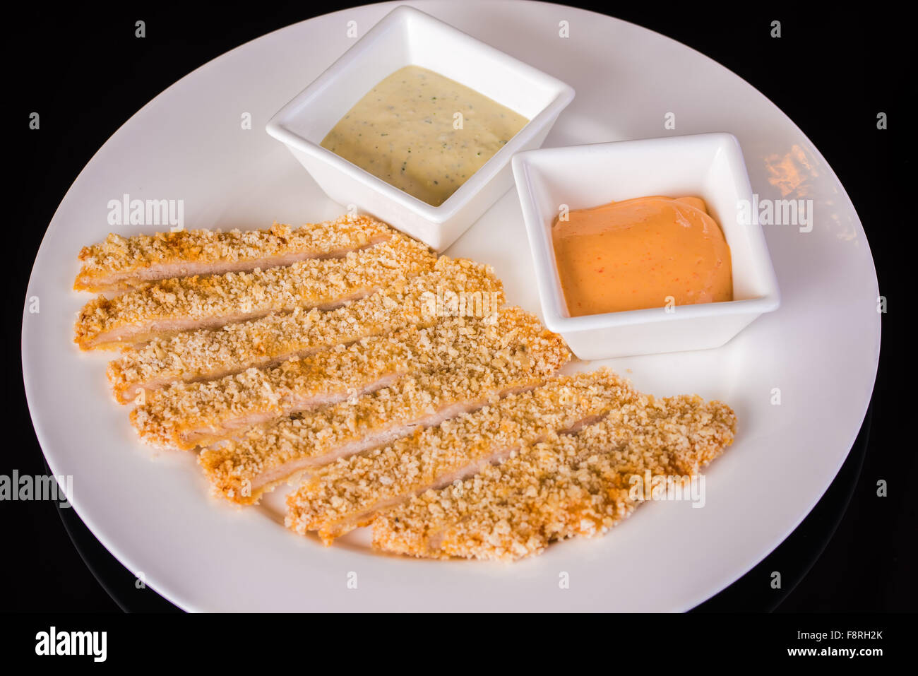 Fish fillets with sauces Stock Photo Alamy